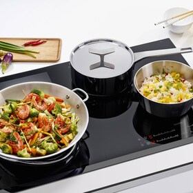 A selection of cookware on an induction hob