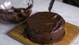 The finished chocolate sponge cake covered in silky icing