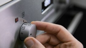 Pouring water into the steam cavity and turn the PlusSteam button on the Electrolux Multifunction Oven with PlusSteam