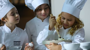 Children baking at the Electrolux Bake For Someone pop-up bakery