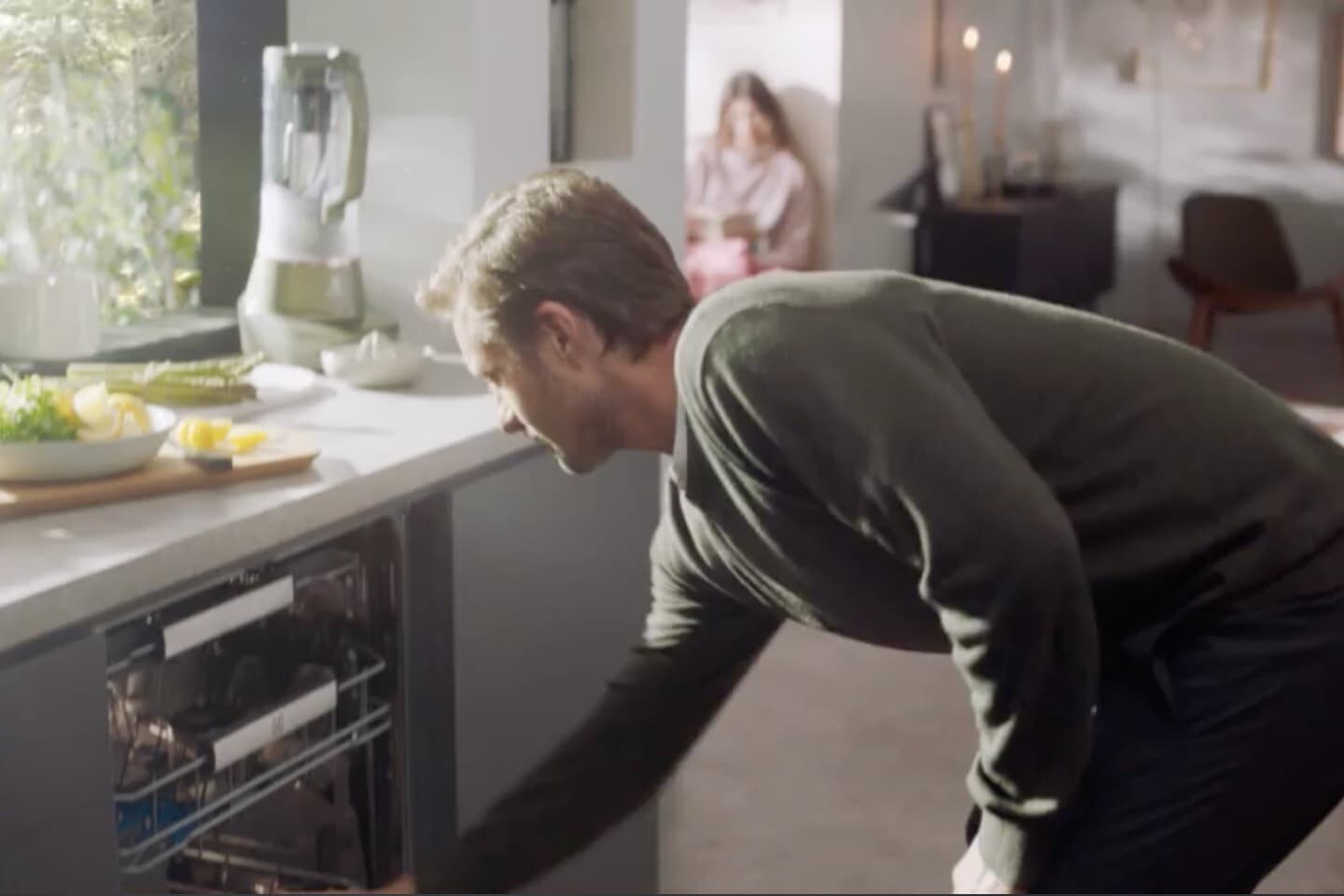 Opens dishwasher Opens dishwasher